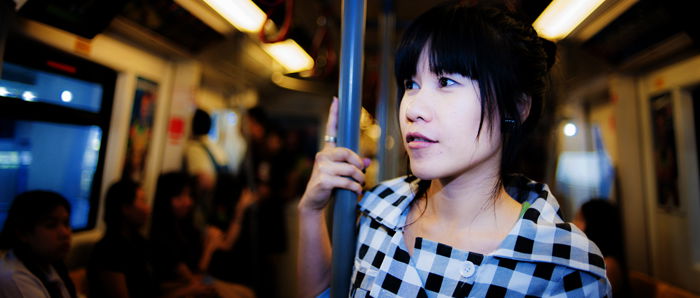 Portrait of a girl standing on a train 