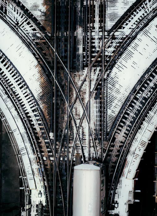 An overhead shot of crossed railway lines