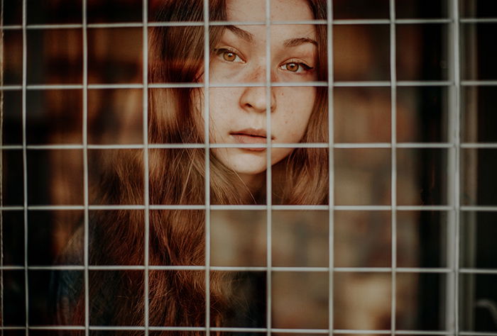 A cut-out photo portrait of a brown haired girl created in Photoshop