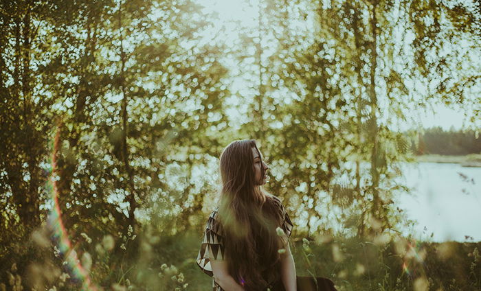 Beautiful outdoor portrait of a long haired female model - ambient light for better portraits