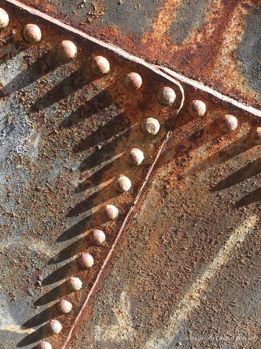 A close up of rusty metallic machinery part taken with iPhone photography camera