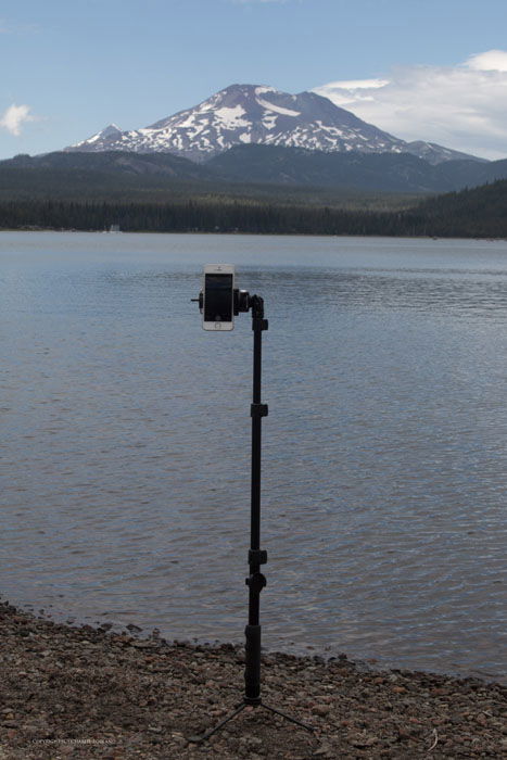 Using a tripod for an iphone photo pointed towards a lake and mountain