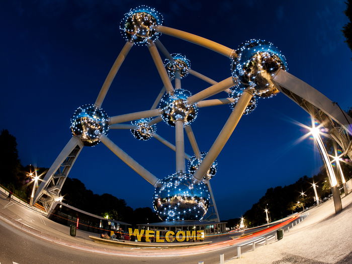 fish eye photo of The Atomium from the bottom, against a deep blue night sky