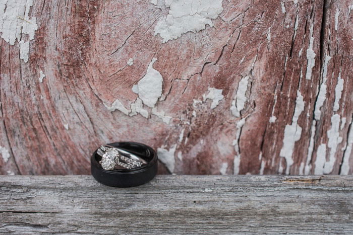 A shot of two wedding rings on a wooden background