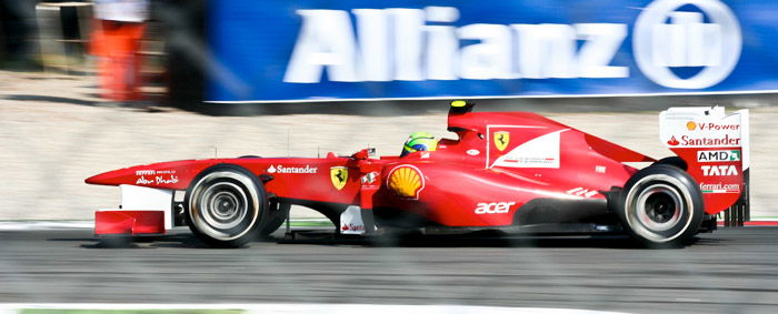 a red sports car racing at the 82nd Italian GP Monza - avoid camera shake