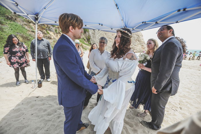 Sweet event photography shot of a wedding couple making their vows