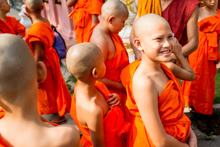 A group of young novice monks smiling