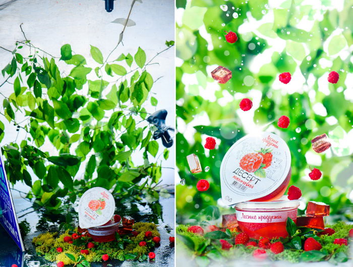 raspberry jelly packets, photo edited with raspberries falling around the container, green leaves in the background