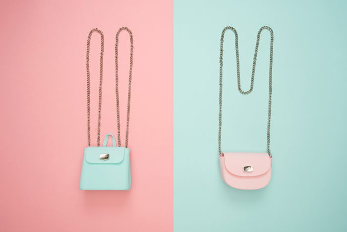 pastel candy colored shoulder bags on opposite backgrounds, peach pink and mint