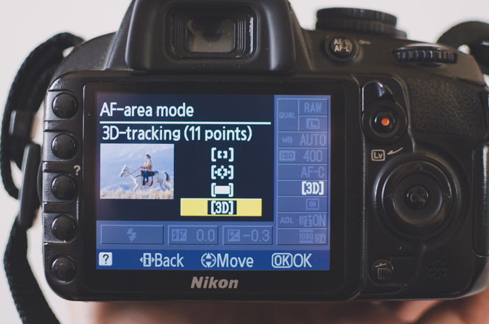 The screen of a Nikon camera showing AF-area mode settings with 3D-tracking selected to learn DSLR basics