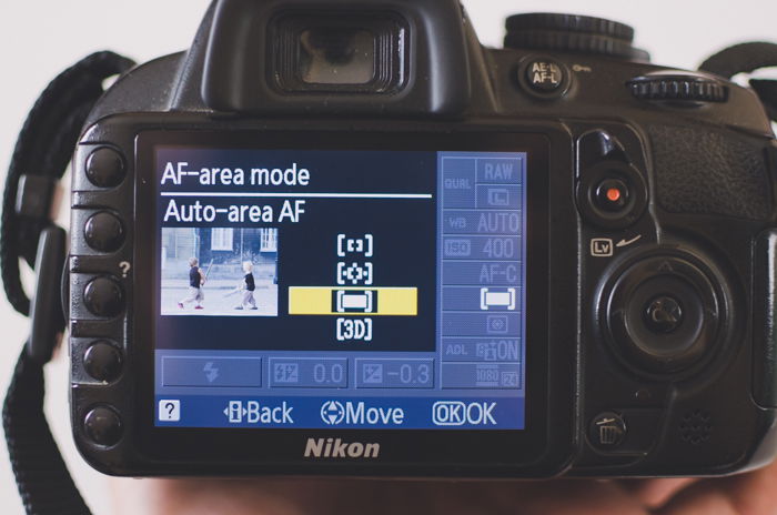 The screen of a Nikon camera showing AF-area mode autofocus settings to learn DSLR basics