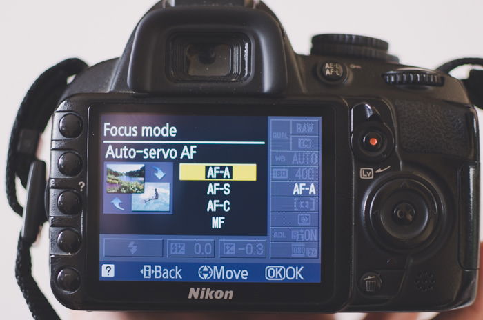 A photo of the focus mode menu on a Nikon camera showing auto autofocus to learn DSLR basics