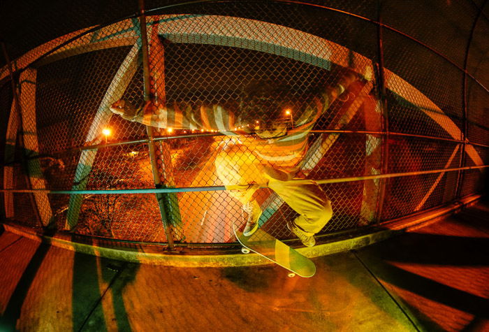 Atmospheric photo of a skateboarder shot using color gel photography