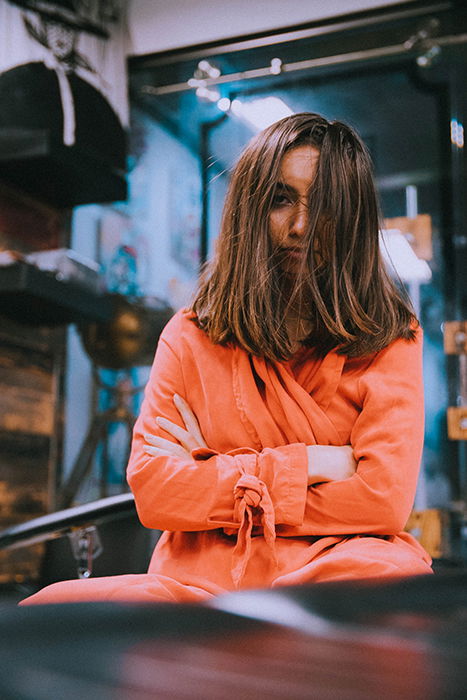 An interesting profile picture of a brown haired girl posing with hair all over her face 