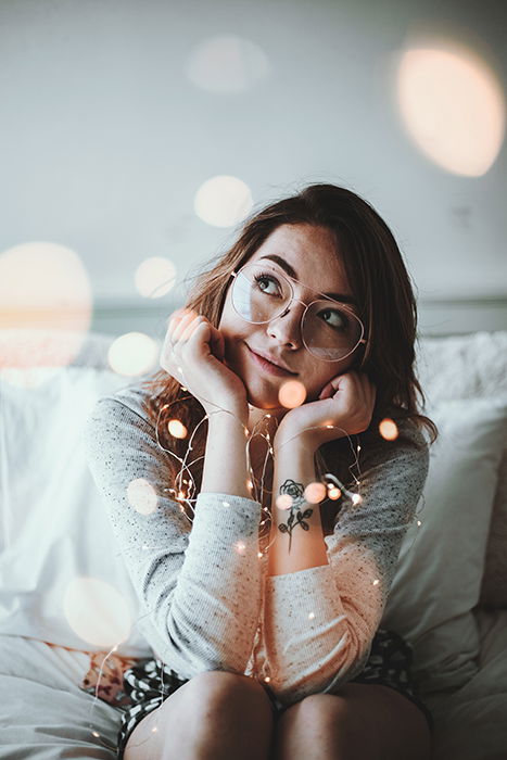 An indoor portrait of a brunette woman