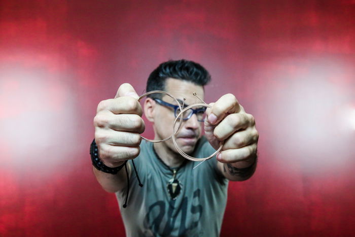 A male model posing against red background - portrait photography shot list