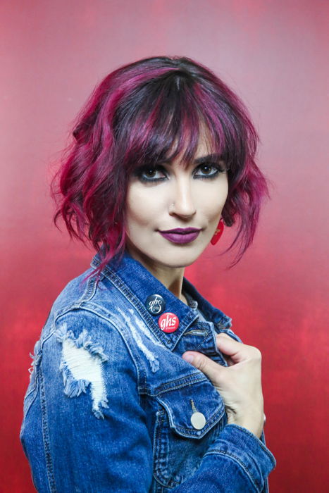 A female model posing against red background - portrait photography shot list