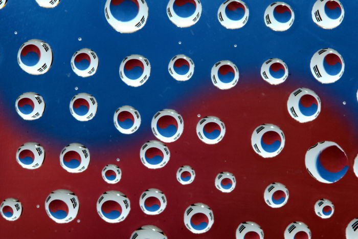 Cool water droplet photography on top of the South Korean flag 