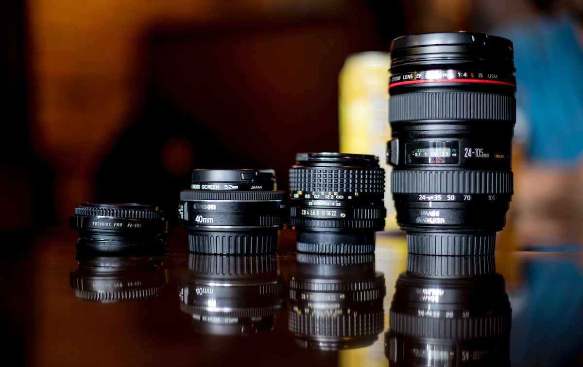 Four lenses on a table with reflections