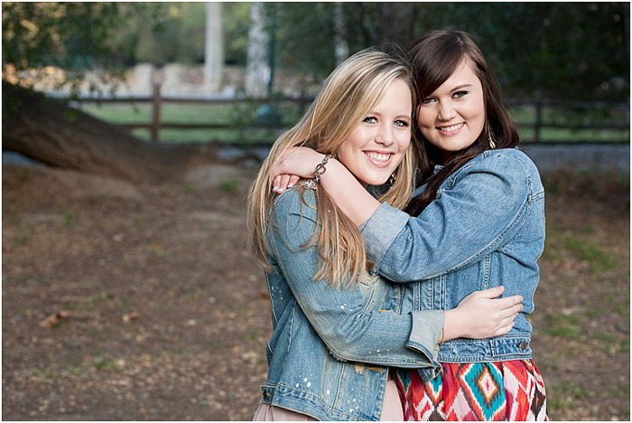 Sweet senior photography shot of best friends posing outdoors