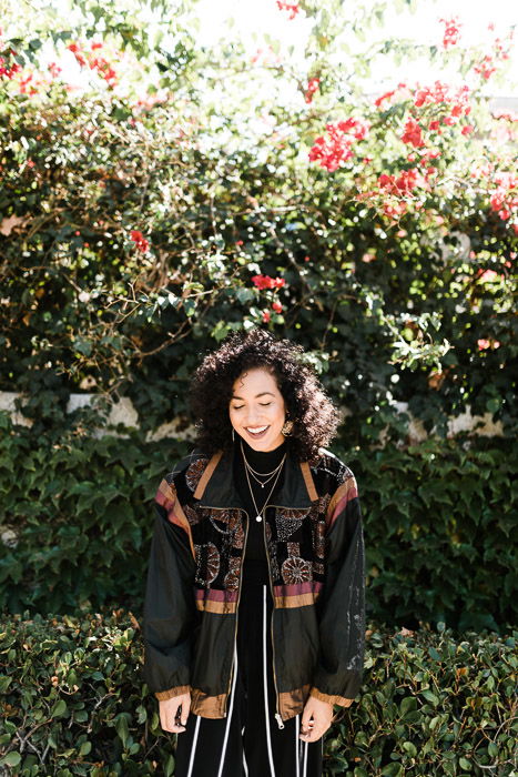 A bright and airy outdoor potrait of a female model shot using an outdoor strobe light 