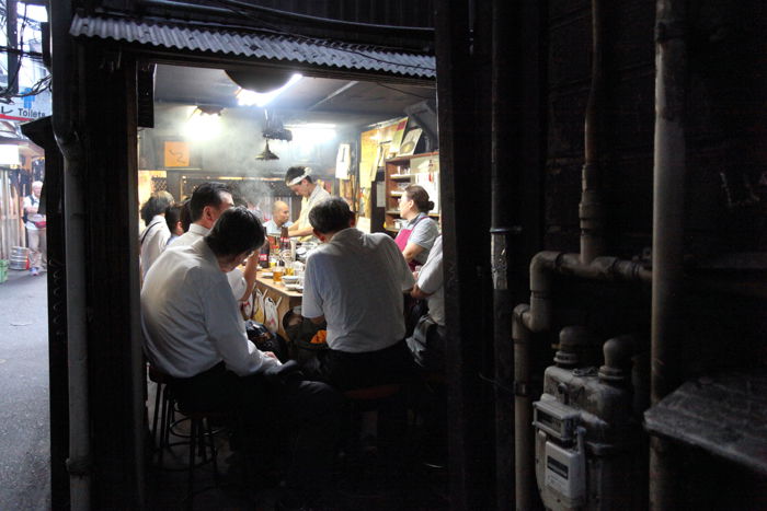 Candid street shot of a busy back alley in Tokyo