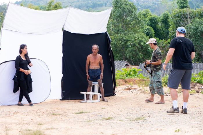 Setting up an outdoor photo studio with a white photography background