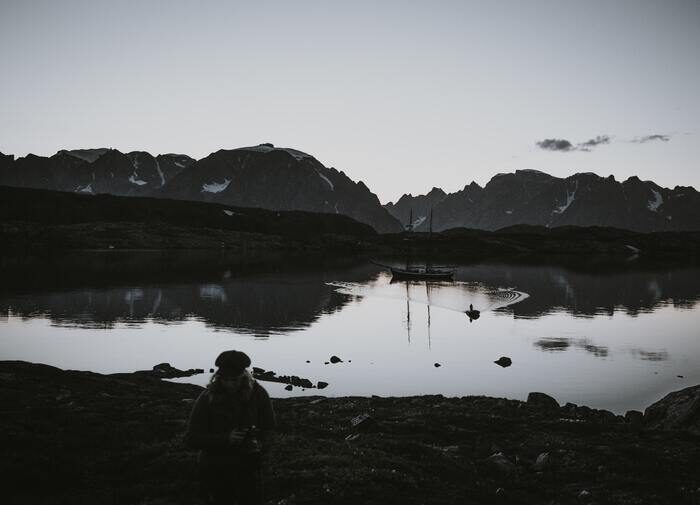 Black and white photo of a lake and mountains