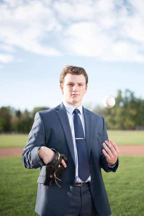 A portrait of a young man posing outdoors with beautiful blurred background 