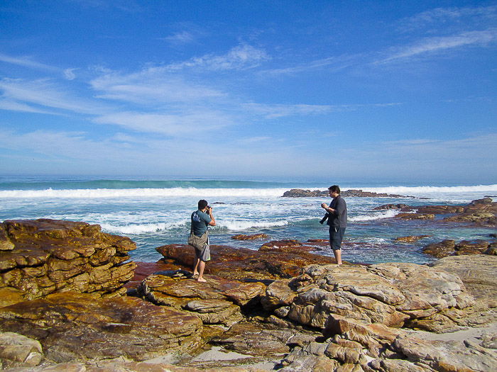 Shooting a stock photo session at coastal rocks