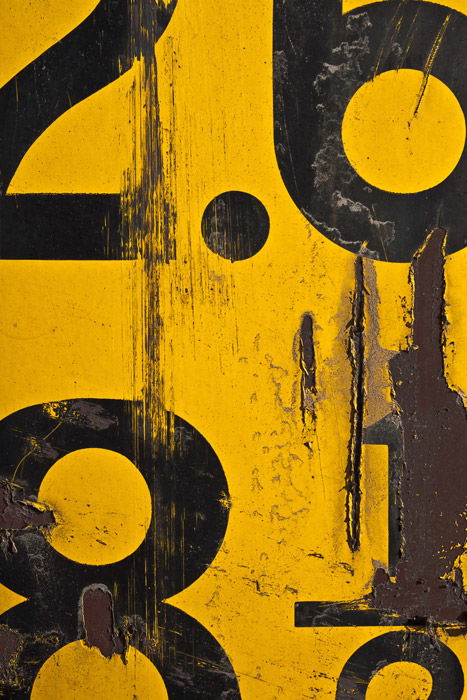 Close up of a yellow and black industrial sign