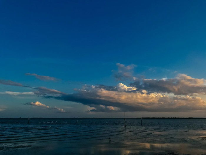 A dark shot of cloud over a seascape