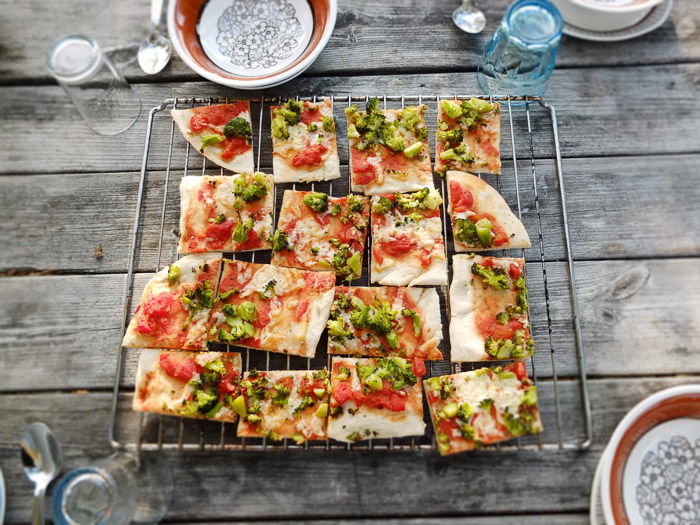 A wire rack full of pizza squares 