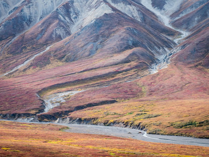 A stunning fall landscape shot of mountains and a river