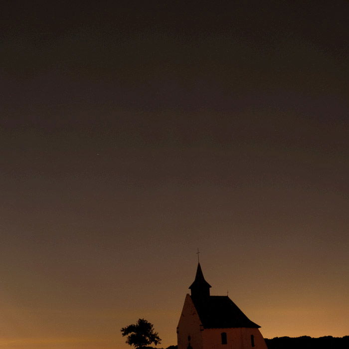 A night sky image over a church