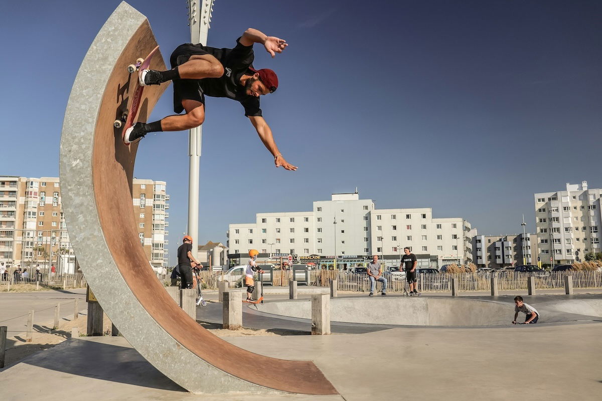 A skateboarder doing a trick in a half-pipe showing imbalance in photography