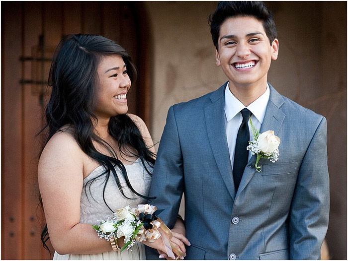 Cute prom photography of a teen couple posing outdoors