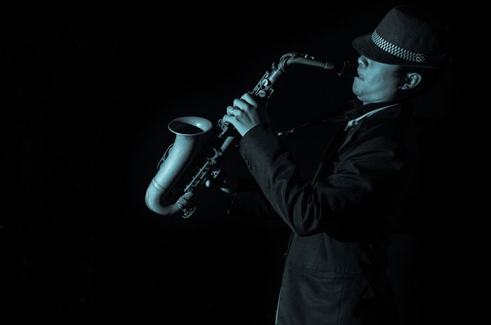 A person playing a saxophone.