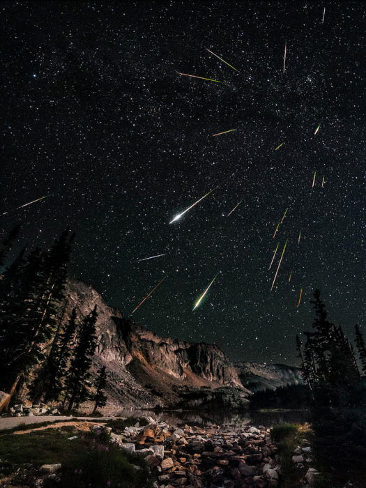 A nice nocturnal landscape showing many meteors coming towards the photograph, adding a 3D feeling to the image