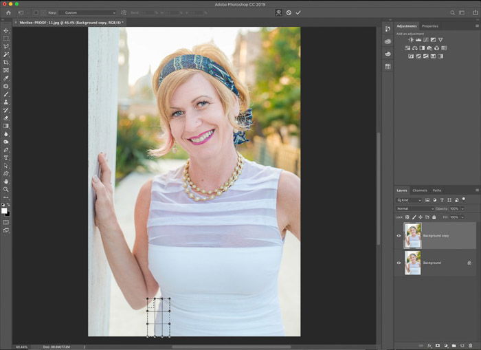 A screenshot showing how to use the Photoshop warp tool for editing portrait photography