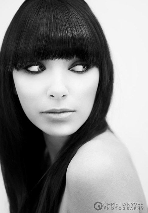 A black and white portrait of a female model, shot using bounce flash -Off-camera flash bounced off the ceiling, by Christian Y Ocampo