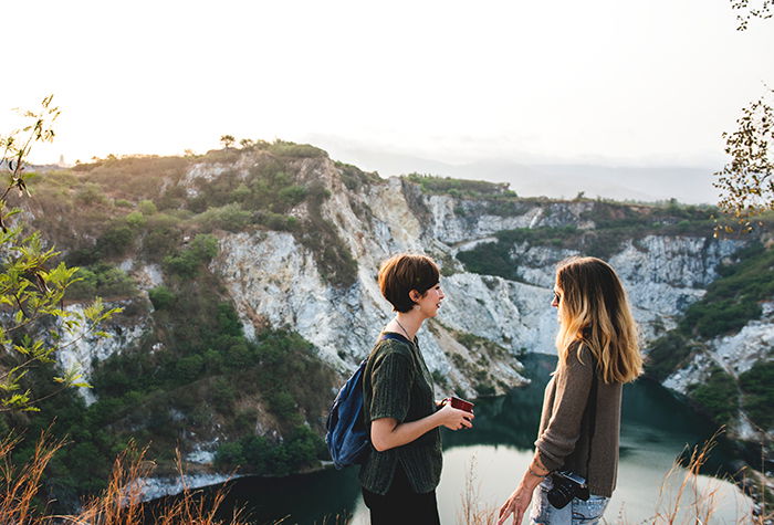 A candid portrait of two girls chatting outdoors