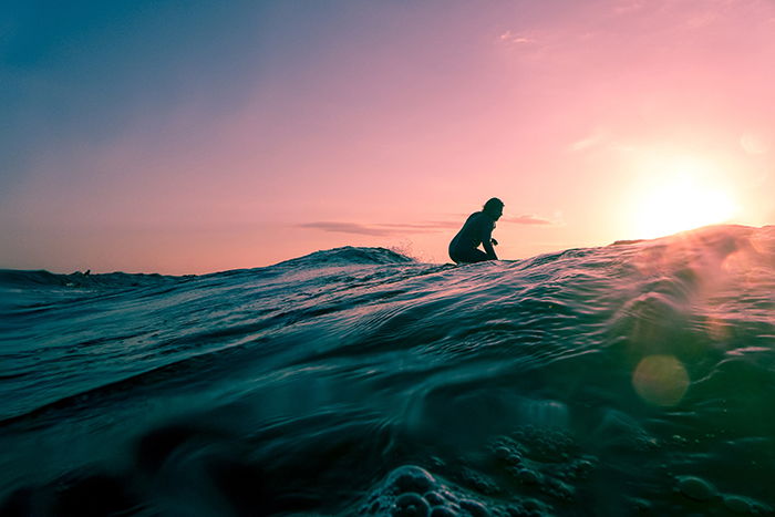 Atmospheric evening shot of a surfer 