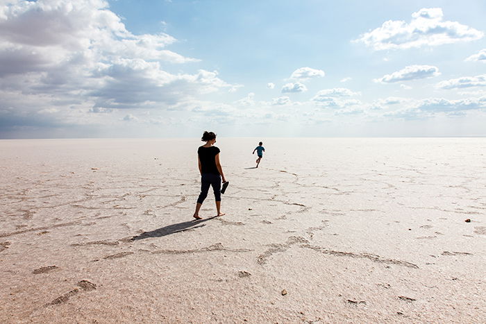 Candid photo of a mother and sun on the beach