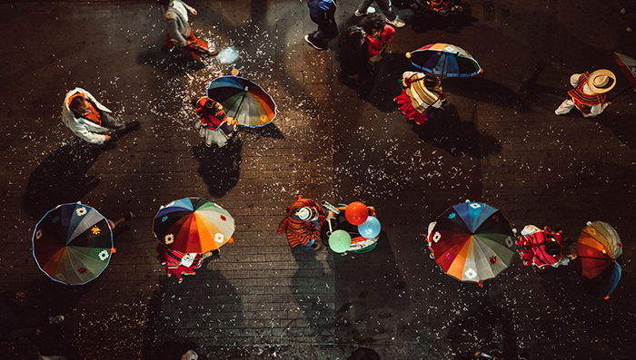 An aerial photo of multiple dancers in colored costumes 