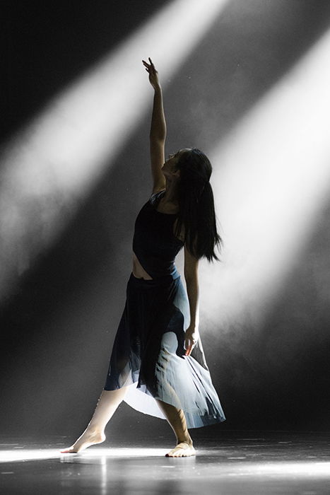 Atmospheric dance photography shot of a female dancer mid performance