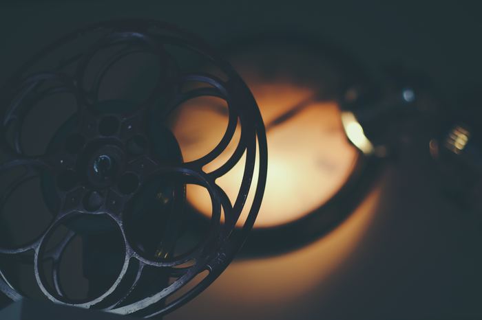 An atmospheric photo of a film reel - best photography movies