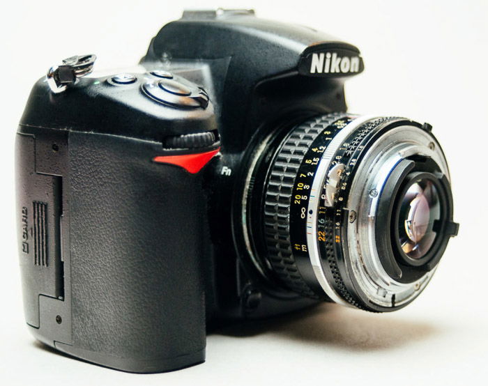 A Nikon dslr camera fitted with reversing rings for macro photography