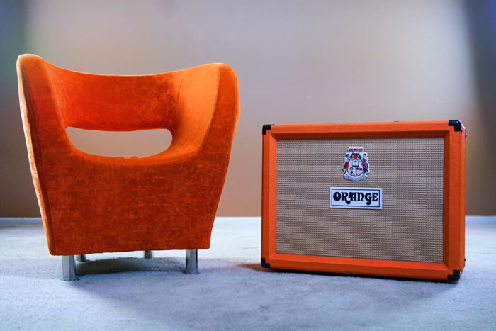 An orange amp beside an orange chair - stock photography trends