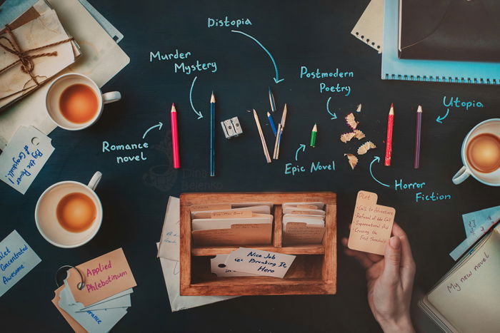 A creative flat lay featuring stationary, coffee cups and notebooks - examples of using text in photography